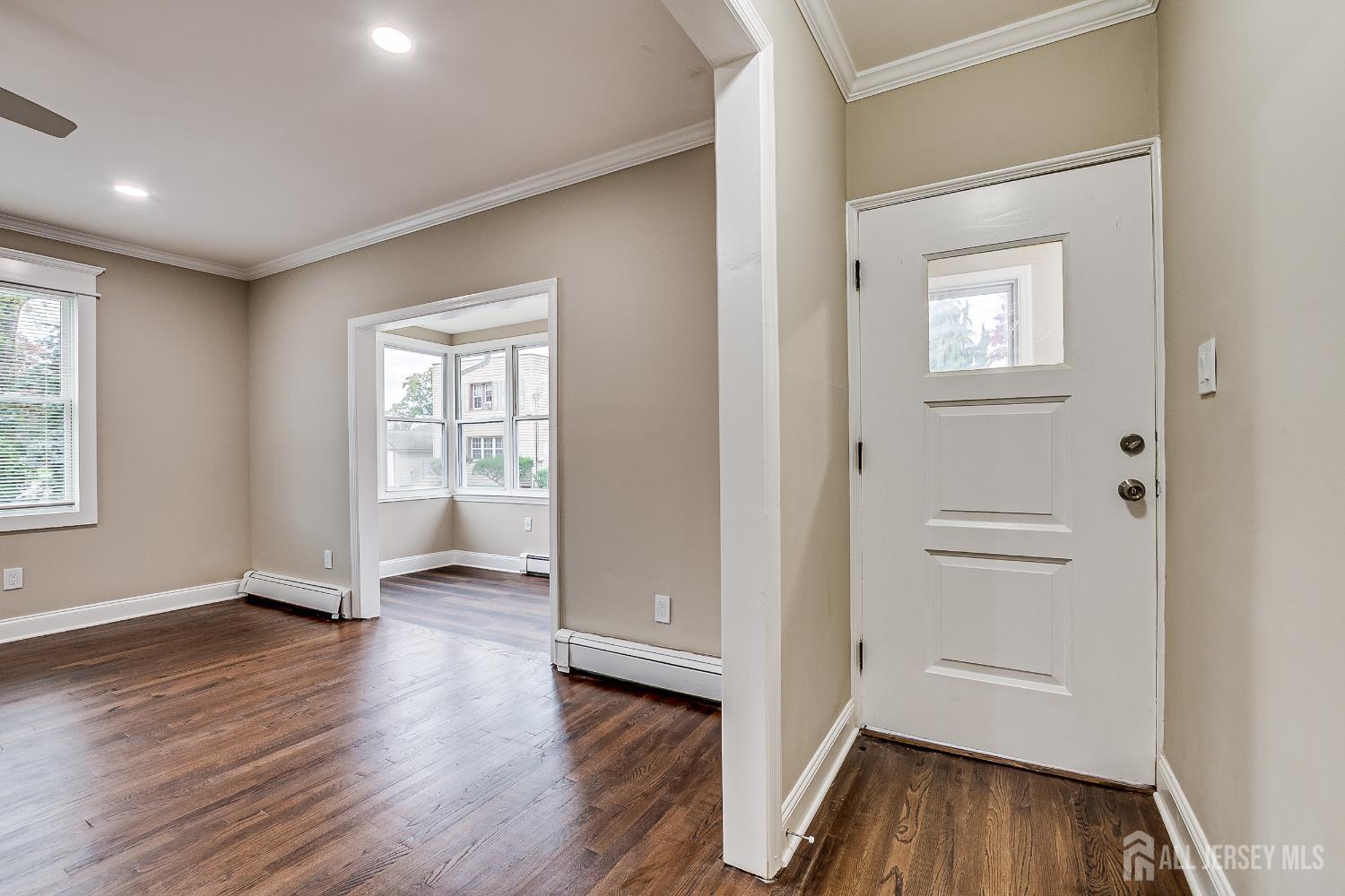 93 Player Avenue Edison, NJ 08817 - Photo 5 of 29 wooden floor in an empty room with a window