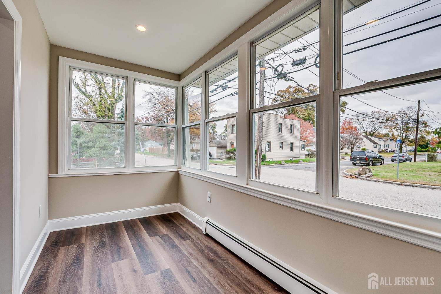 93 Player Avenue Edison, NJ 08817 - Photo 9 of 29 wooden floor in an empty room with a window