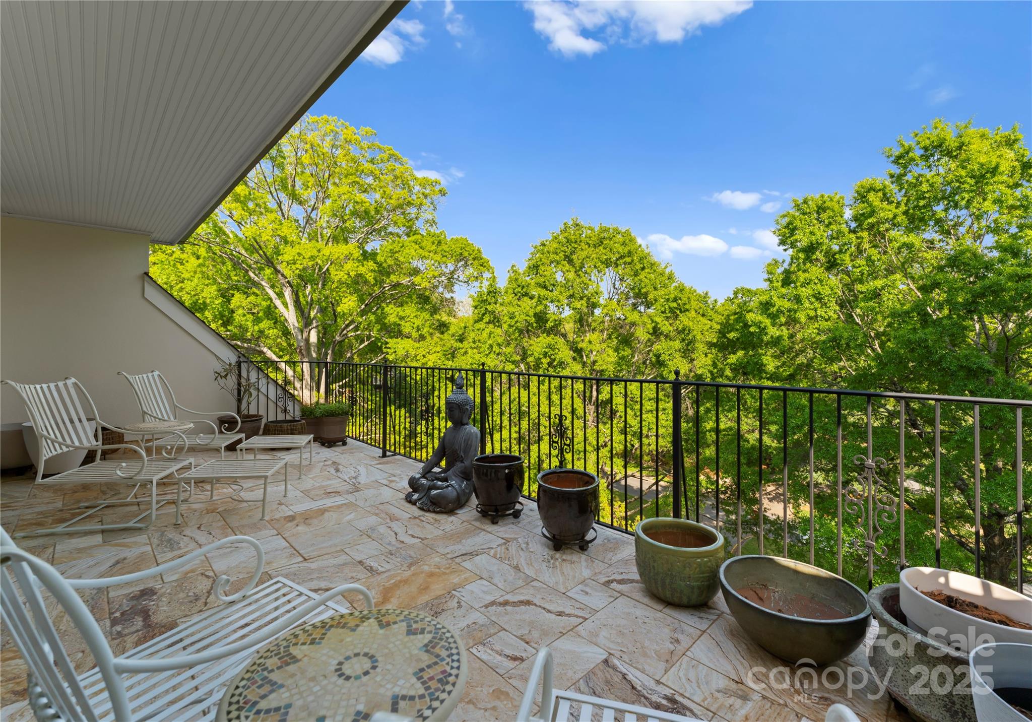 974 Queens Road Charlotte, NC 28207 - Photo 25 of 26 a view of a balcony with chair and potted plants