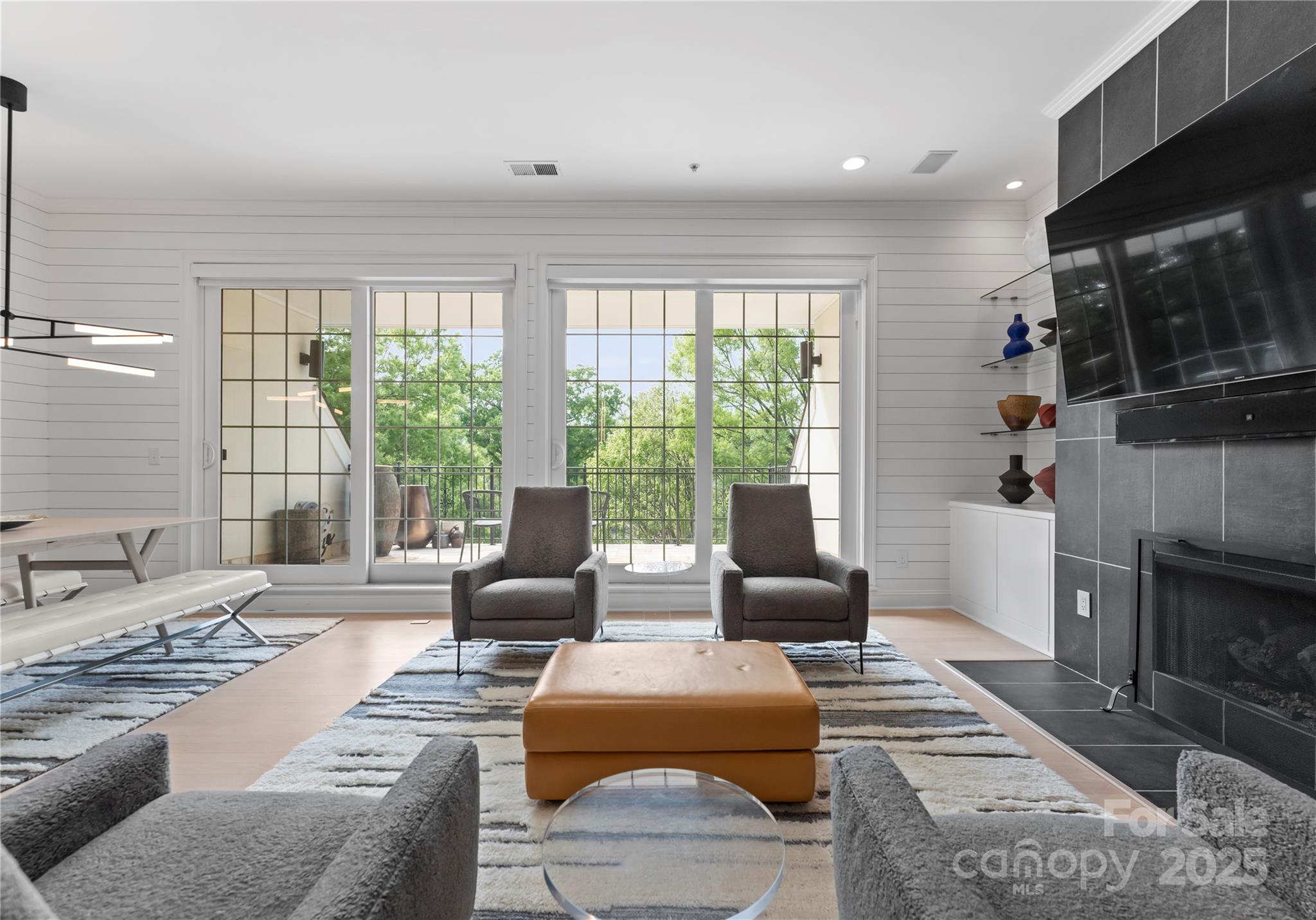 974 Queens Road Charlotte, NC 28207 - Photo 6 of 26 a living room with furniture fireplace and a large window