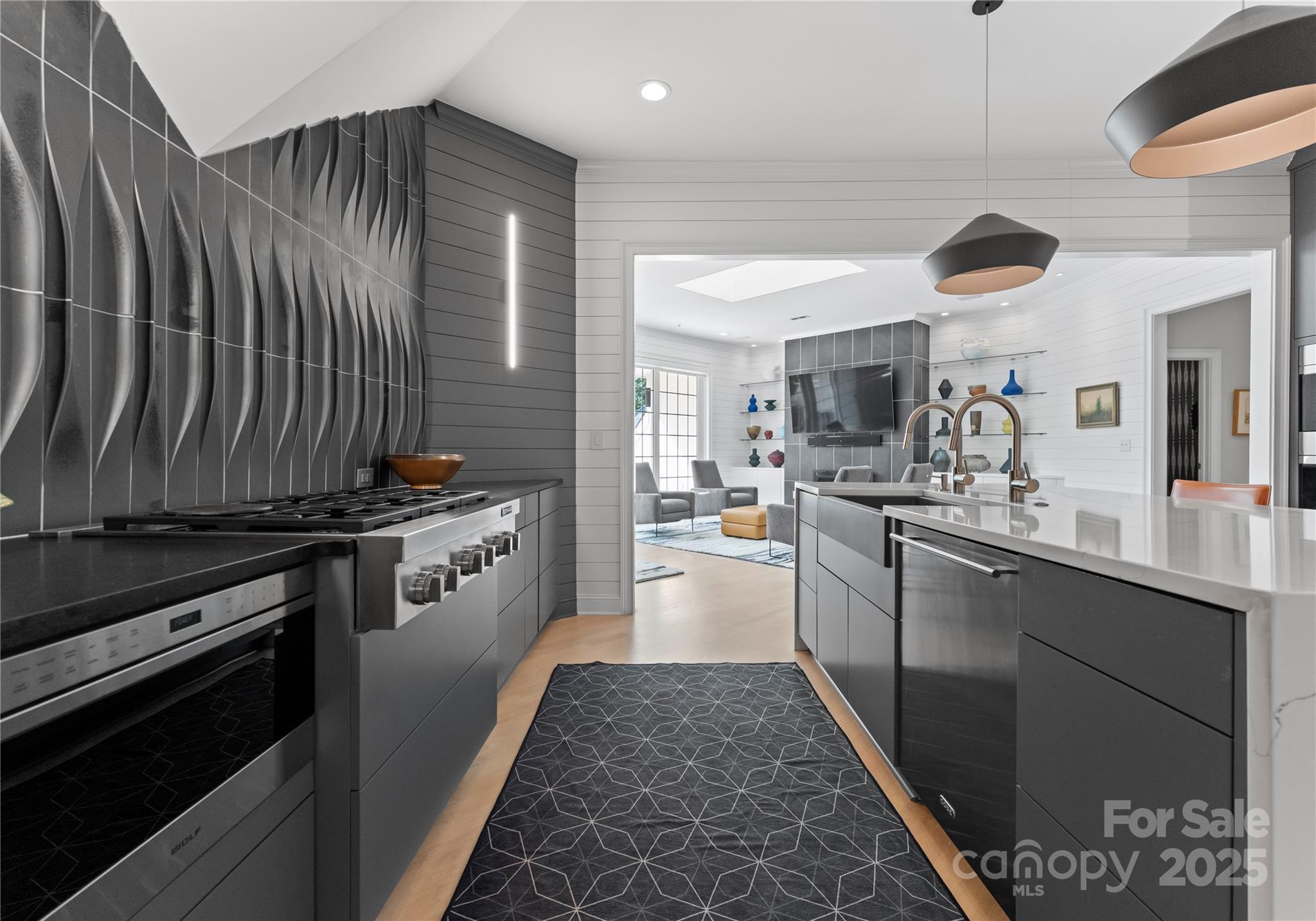 974 Queens Road Charlotte, NC 28207 - Photo 10 of 26 a kitchen with stainless steel appliances granite countertop a stove a sink dishwasher and cabinets with wooden floor