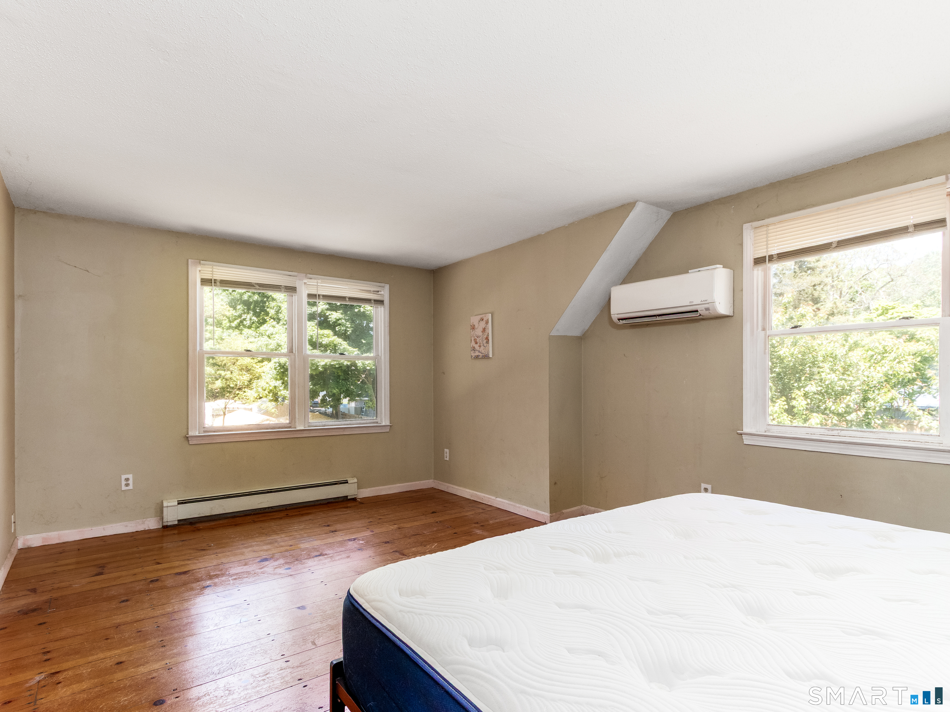 15 Bluff Avenue Clinton, CT 06413 - Photo 19 of 38 a bedroom with a bed and a window