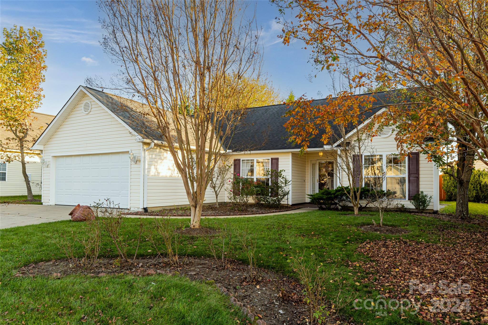 183 Lumber River Road Fletcher, NC 28732 - Photo 1 of 31 a view of a white house next to a yard with big trees