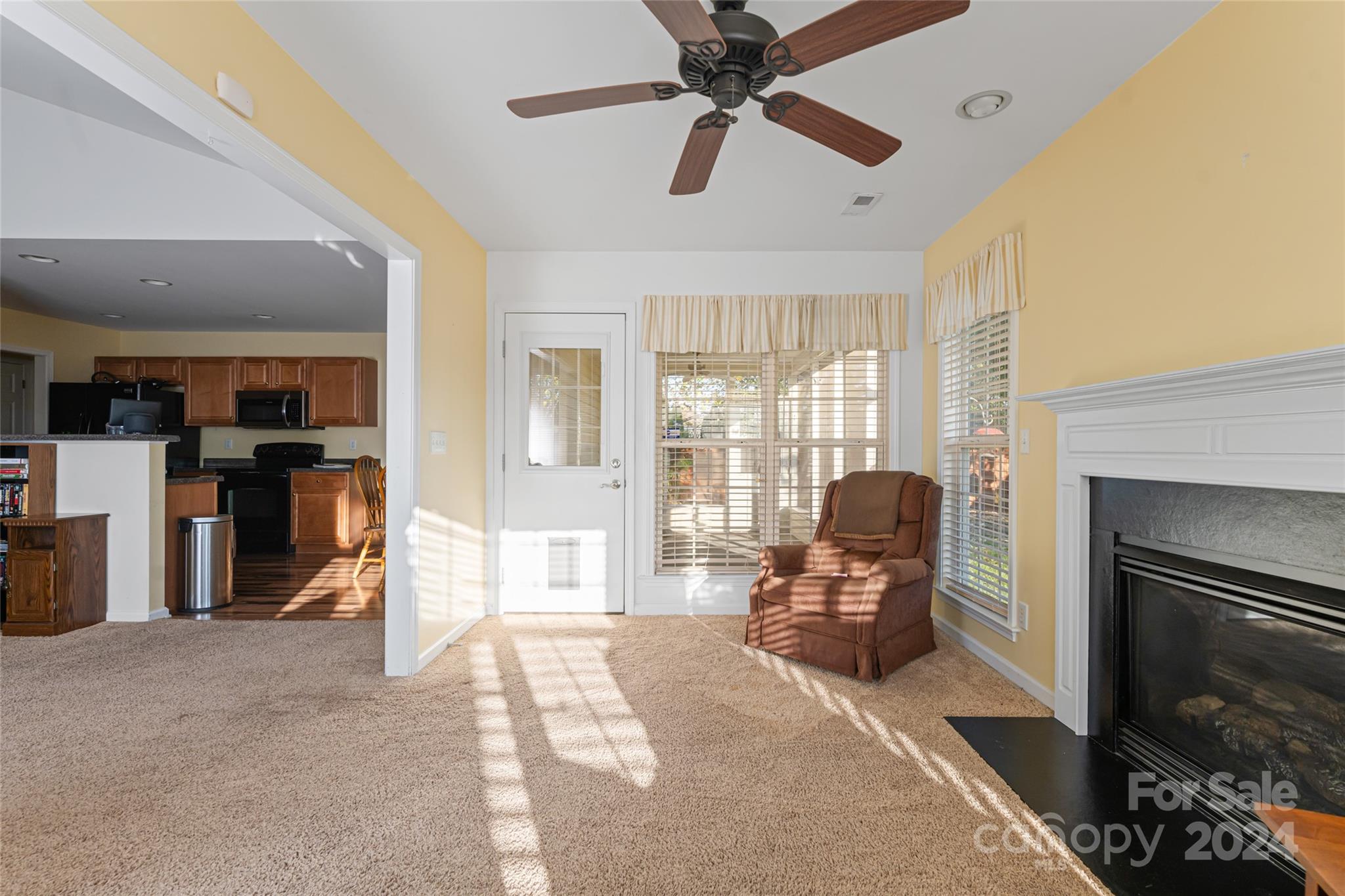 183 Lumber River Road Fletcher, NC 28732 - Photo 11 of 31 a living room with furniture and a fireplace