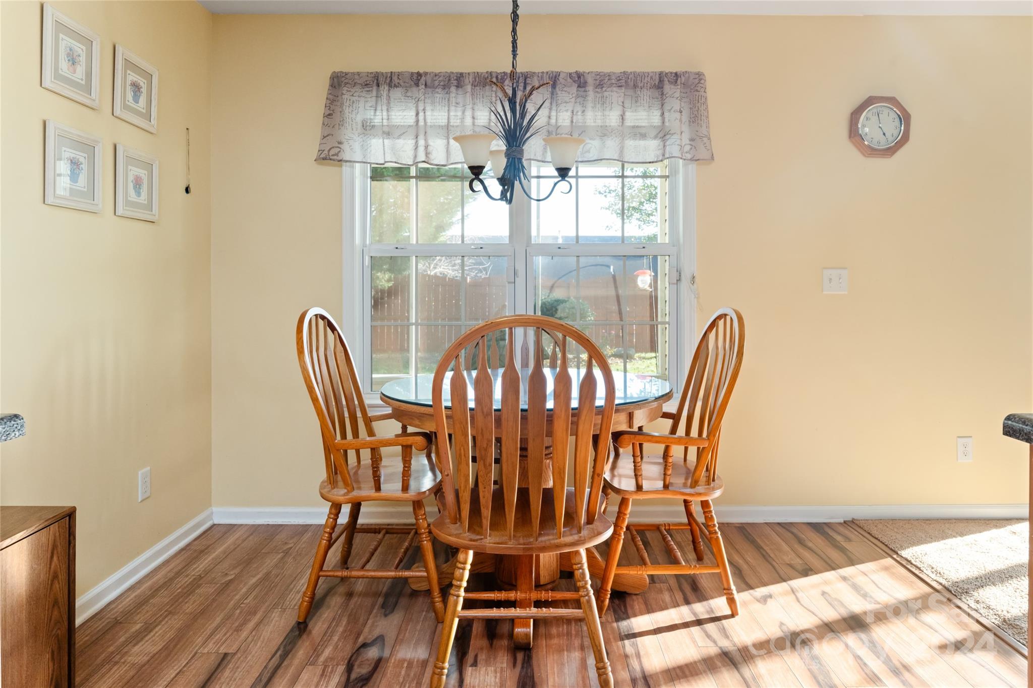 183 Lumber River Road Fletcher, NC 28732 - Photo 13 of 31 a view of a dining room with furniture wooden floor and chandelier
