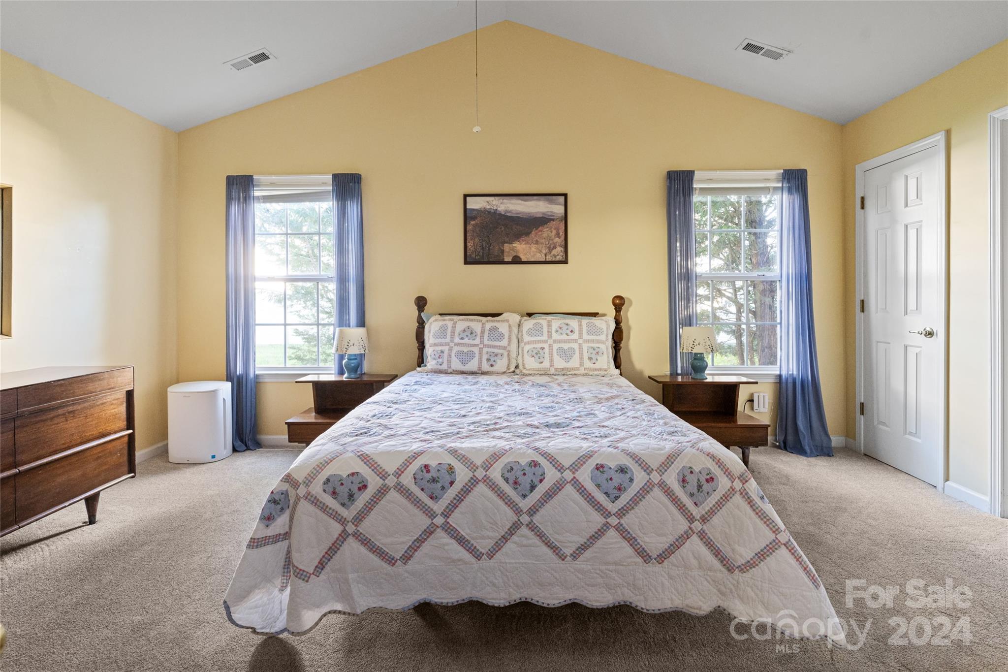 183 Lumber River Road Fletcher, NC 28732 - Photo 16 of 31 a bedroom with a bed and a window