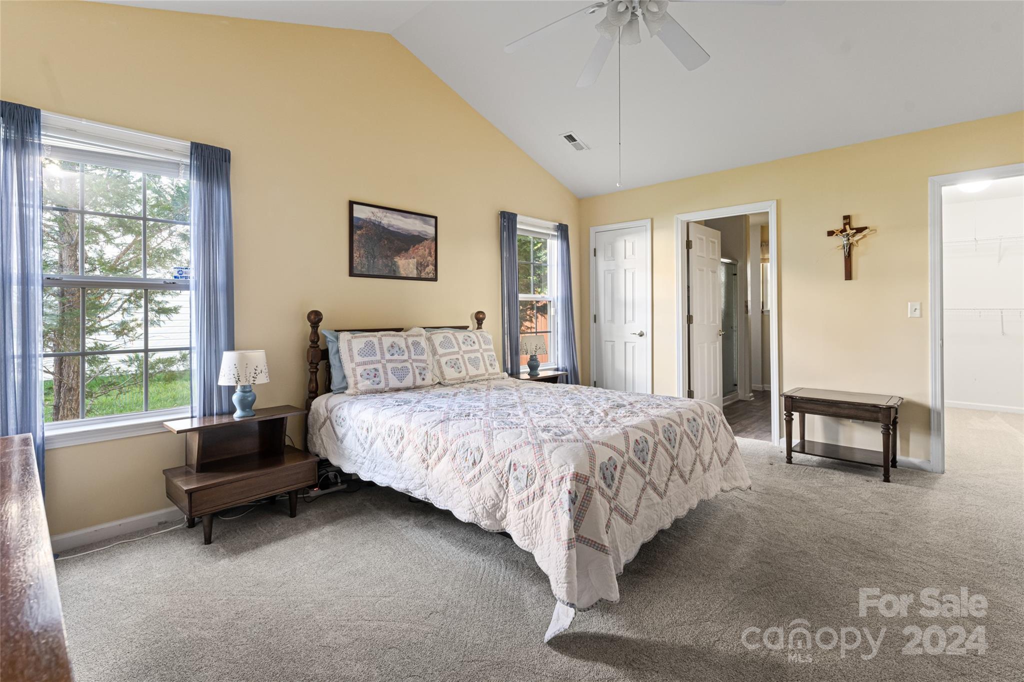 183 Lumber River Road Fletcher, NC 28732 - Photo 17 of 31 a bedroom with a bed and a table in it