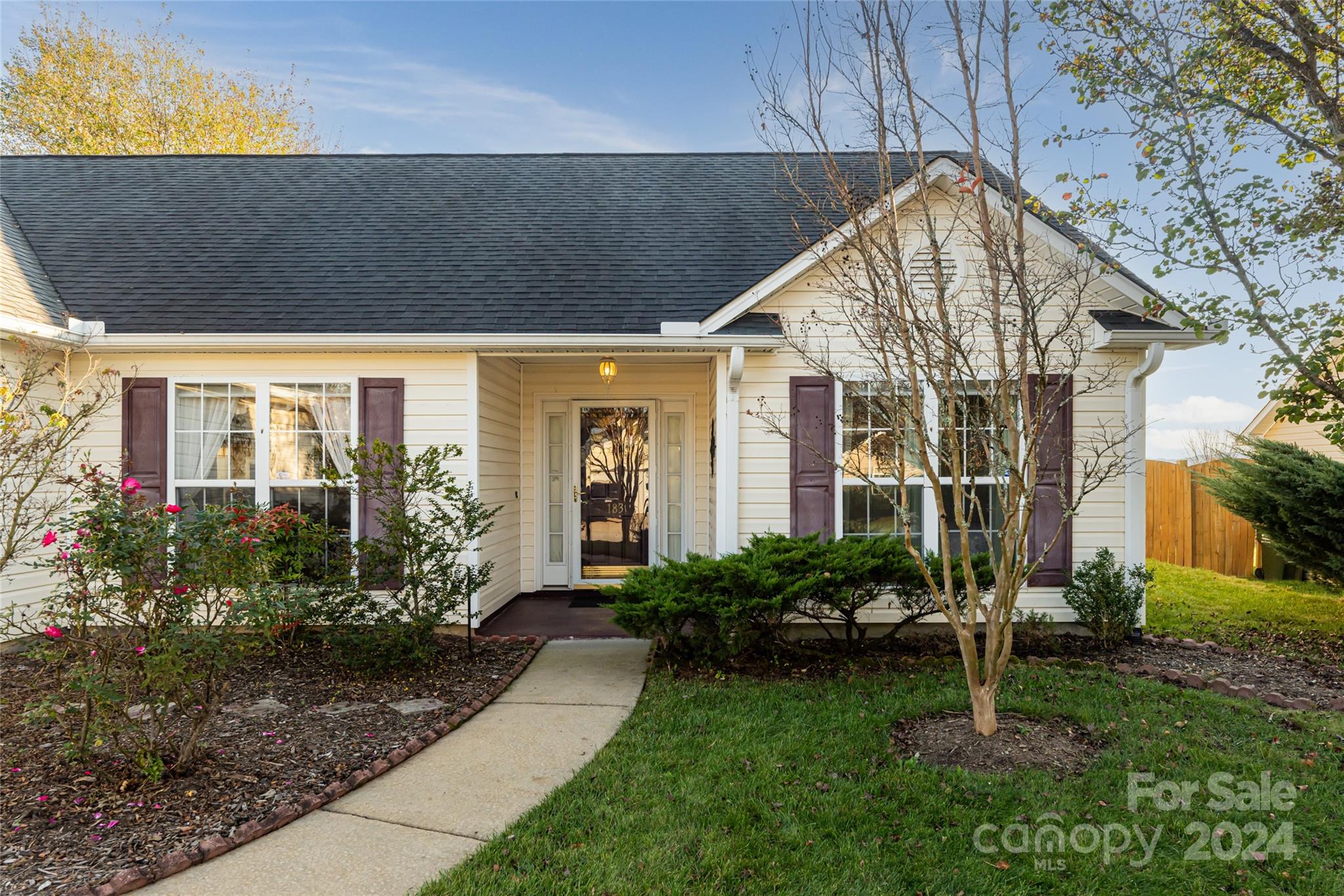 183 Lumber River Road Fletcher, NC 28732 - Photo 2 of 31 a house view with a garden space