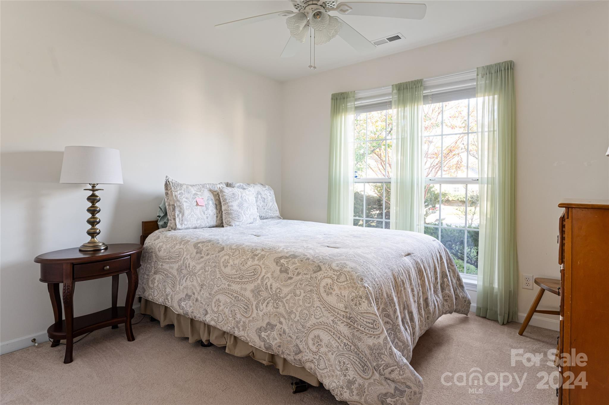 183 Lumber River Road Fletcher, NC 28732 - Photo 21 of 31 a bedroom with a bed chair and a window