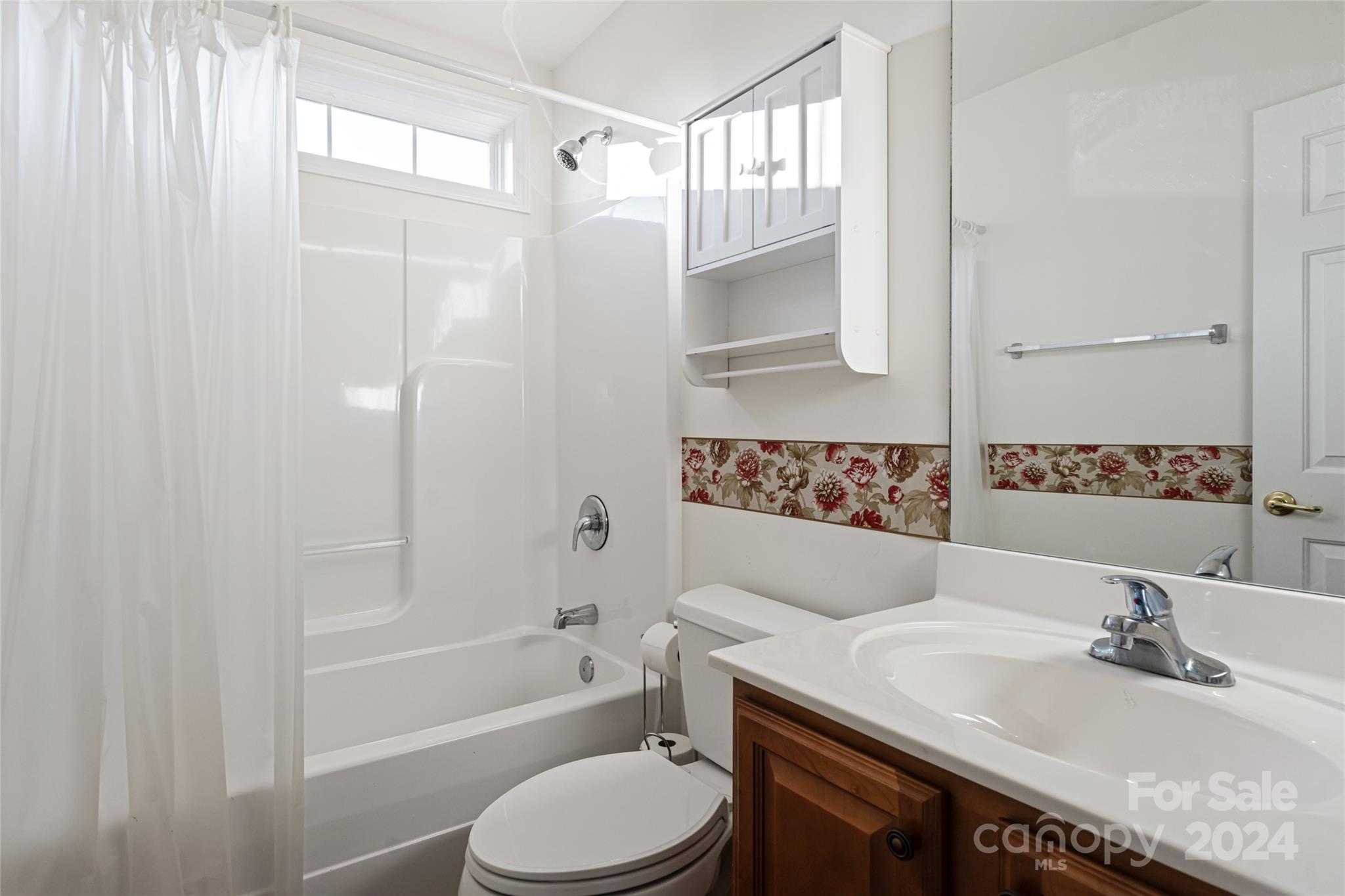 183 Lumber River Road Fletcher, NC 28732 - Photo 22 of 31 a bathroom with a sink a toilet and shower