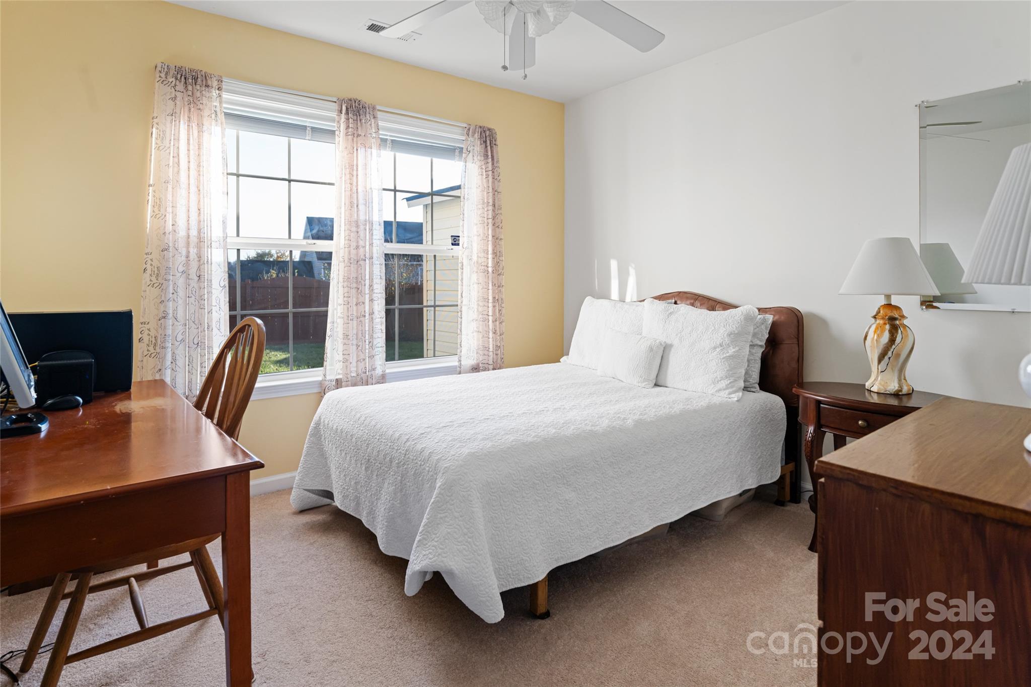 183 Lumber River Road Fletcher, NC 28732 - Photo 23 of 31 a bedroom with a bed and a desk