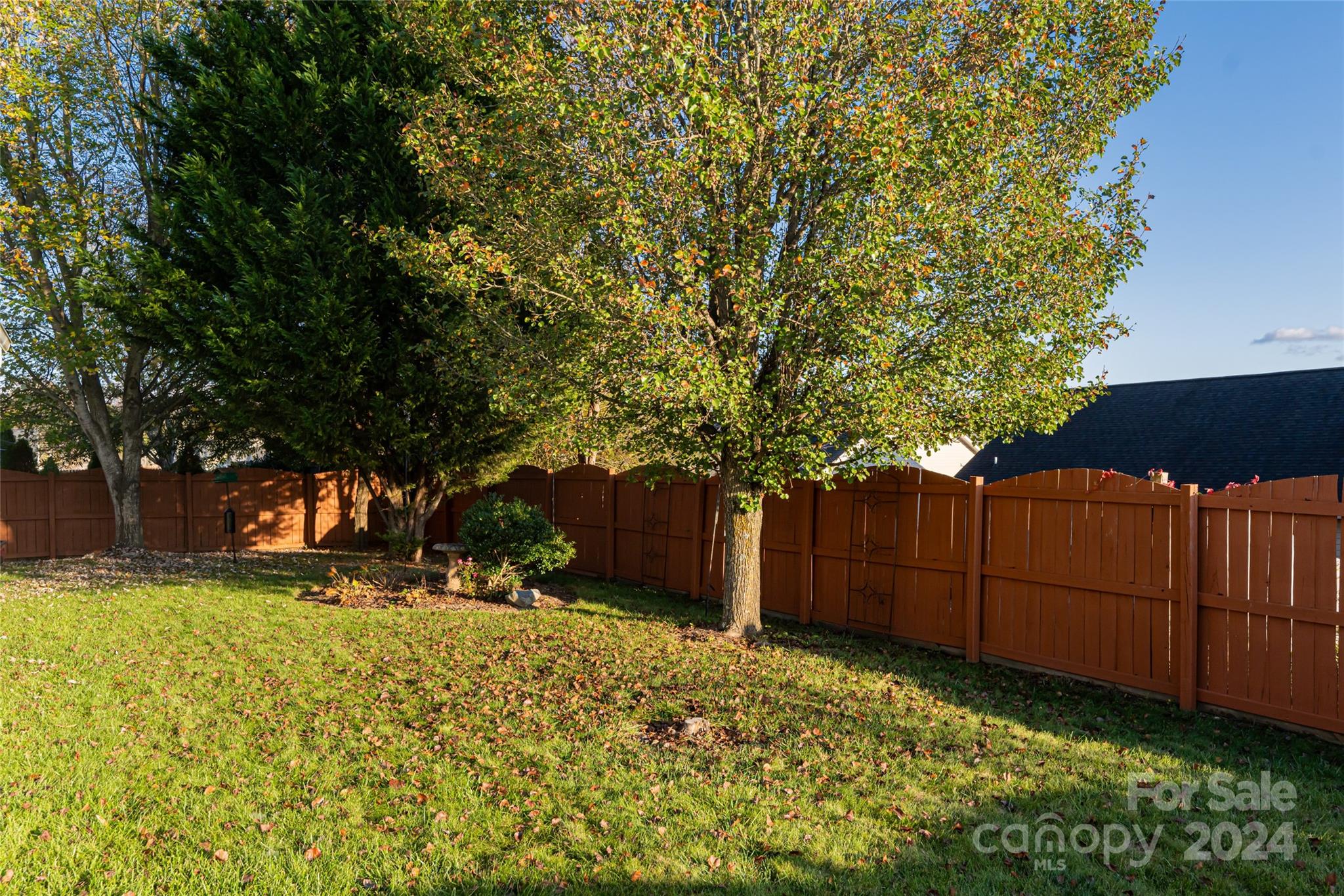 183 Lumber River Road Fletcher, NC 28732 - Photo 28 of 31 a view of a yard with wooden fence