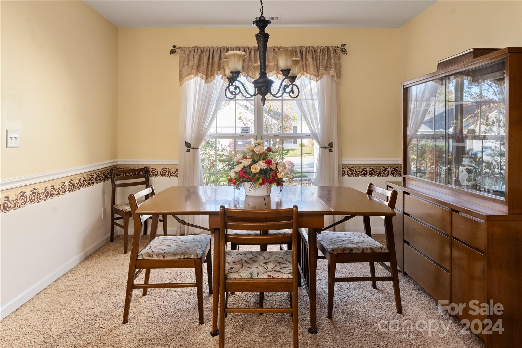 183 Lumber River Road Fletcher, NC 28732 - Photo 5 of 31 a view of a dining room with furniture and chandelier