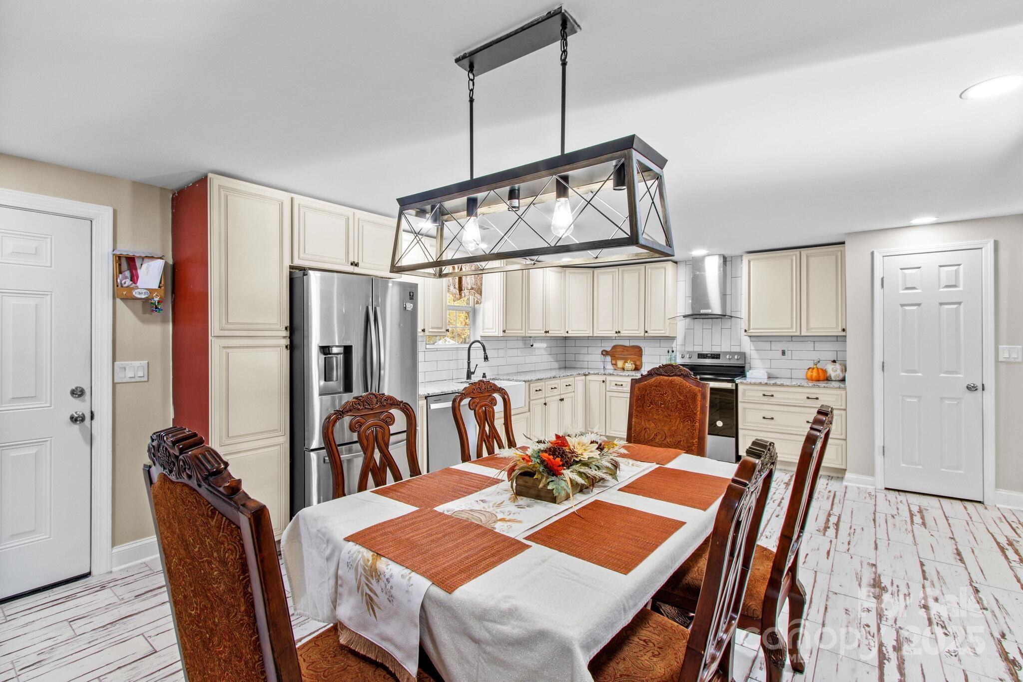1493 Swicegood Road Linwood, NC 27299 - Photo 15 of 45 a view of a dining room with furniture