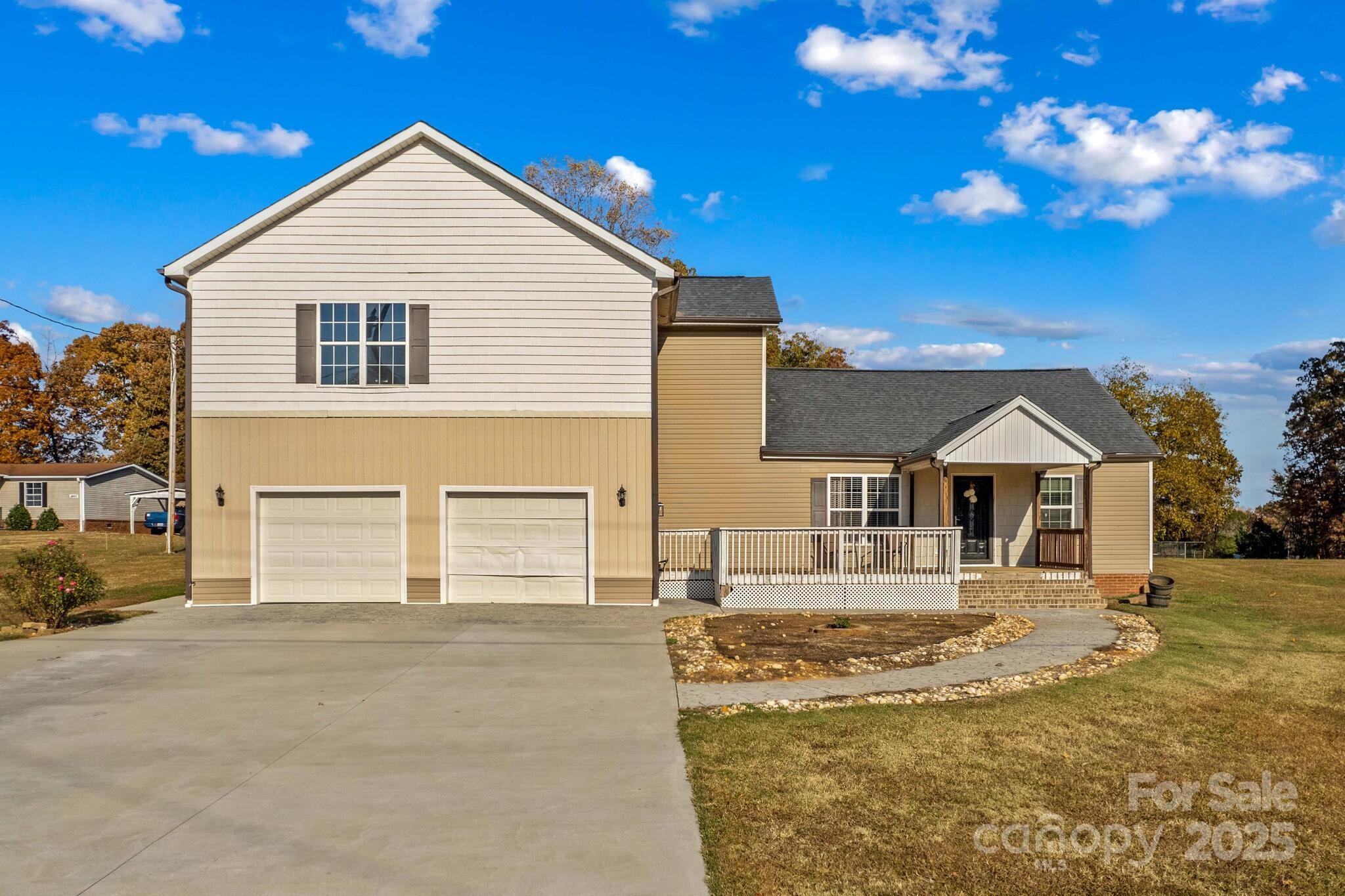 1493 Swicegood Road Linwood, NC 27299 - Photo 3 of 45 a front view of a house with a yard