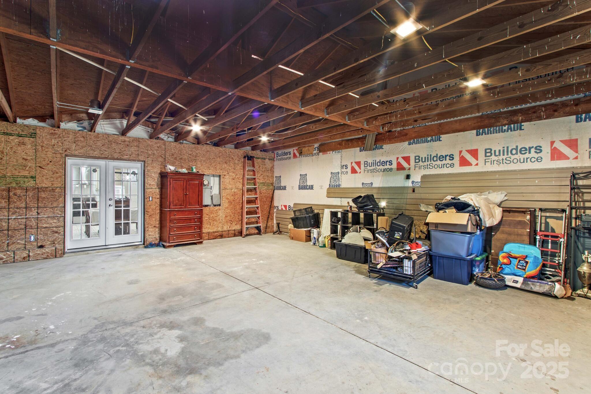 1493 Swicegood Road Linwood, NC 27299 - Photo 36 of 45 a view of parking garage with cars