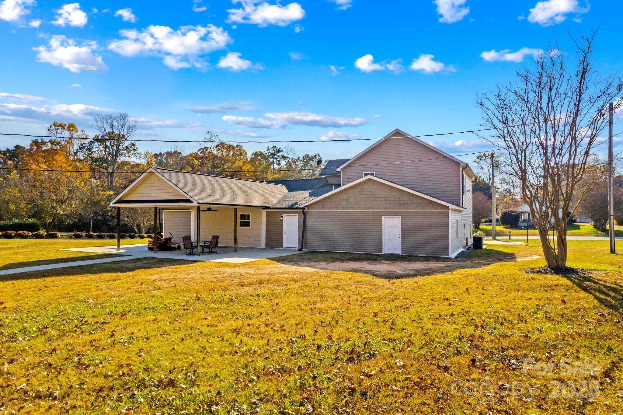 1493 Swicegood Road Linwood, NC 27299 - Photo 37 of 45 a view of a house with a yard