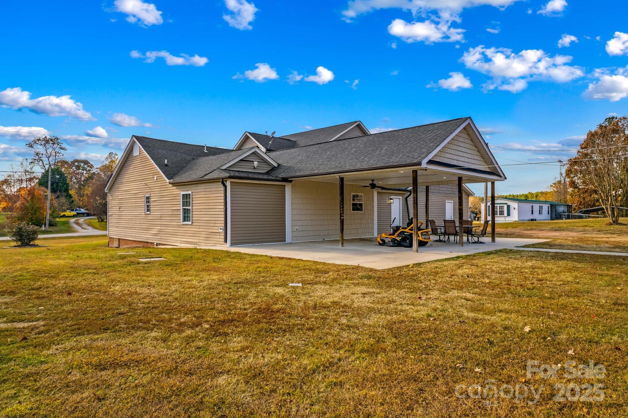 1493 Swicegood Road Linwood, NC 27299 - Photo 40 of 45 a view of a house with pool and chairs