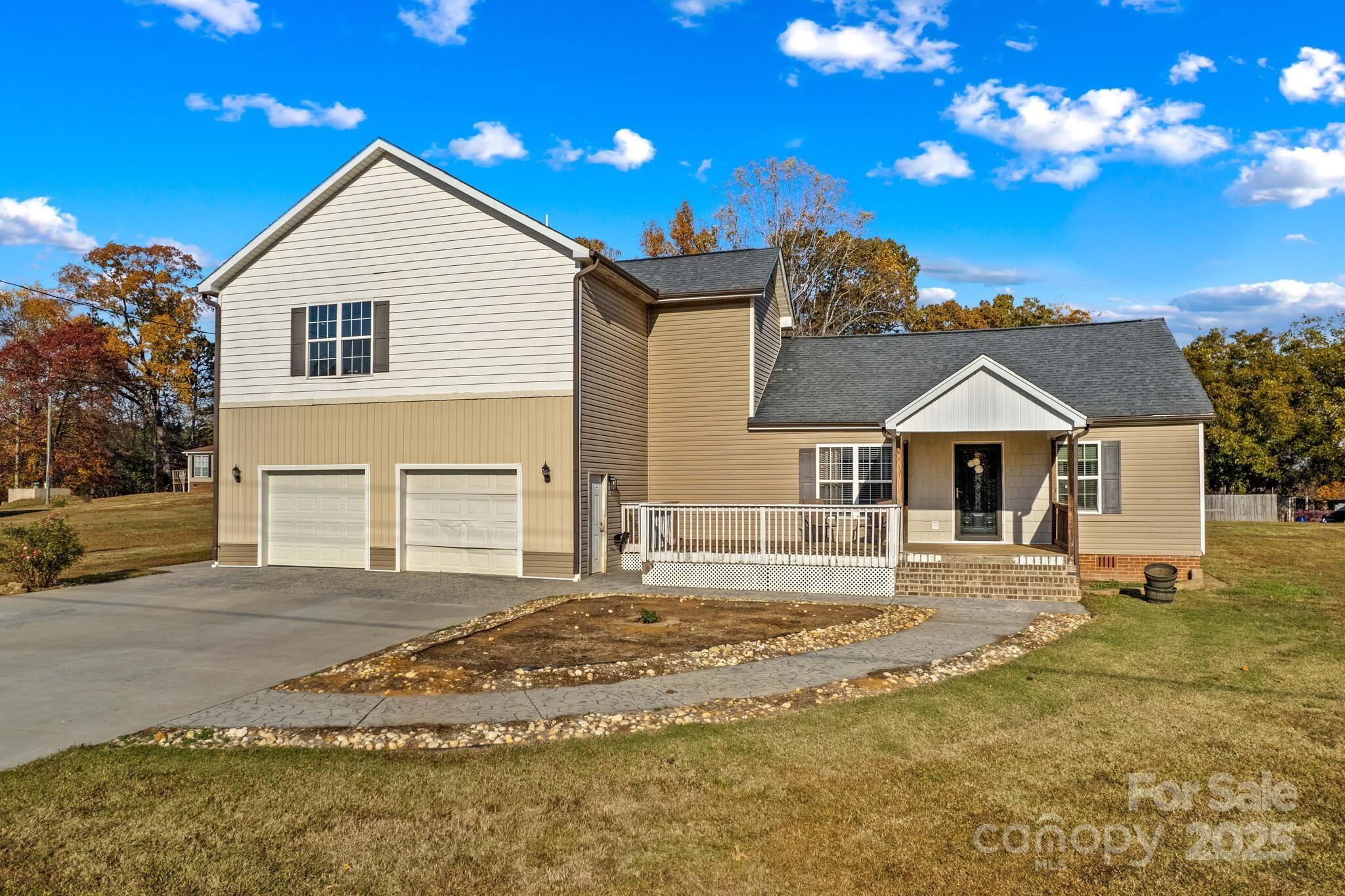 1493 Swicegood Road Linwood, NC 27299 - Photo 4 of 45 a front view of a house with a yard
