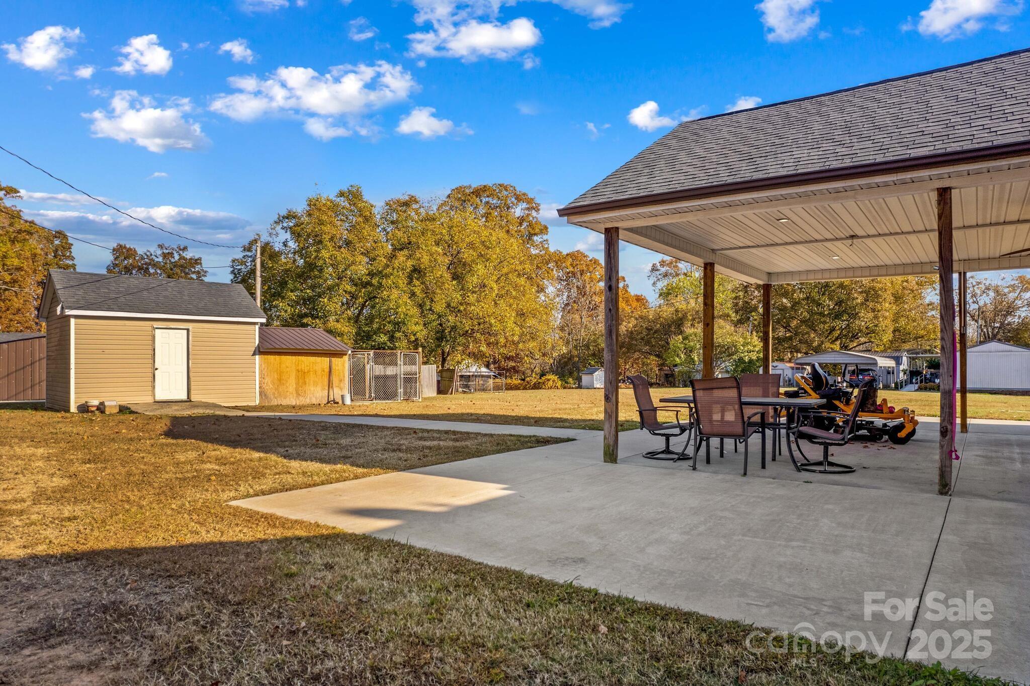 1493 Swicegood Road Linwood, NC 27299 - Photo 41 of 45 a view of a house with backyard and sitting area