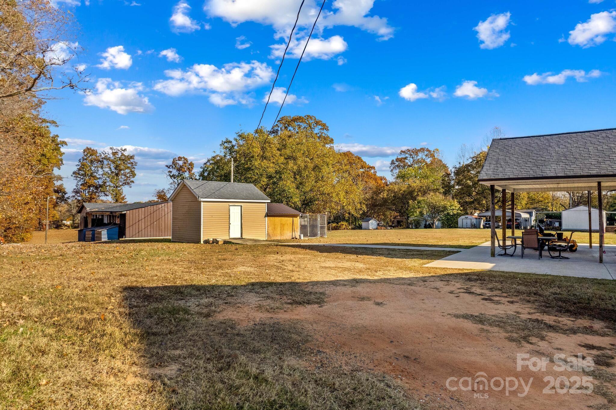1493 Swicegood Road Linwood, NC 27299 - Photo 42 of 45 a front view of a house with a yard and lake view