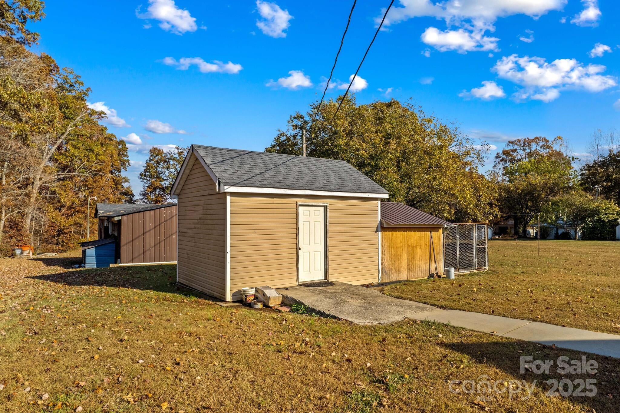 1493 Swicegood Road Linwood, NC 27299 - Photo 43 of 45 a front view of a house with a yard