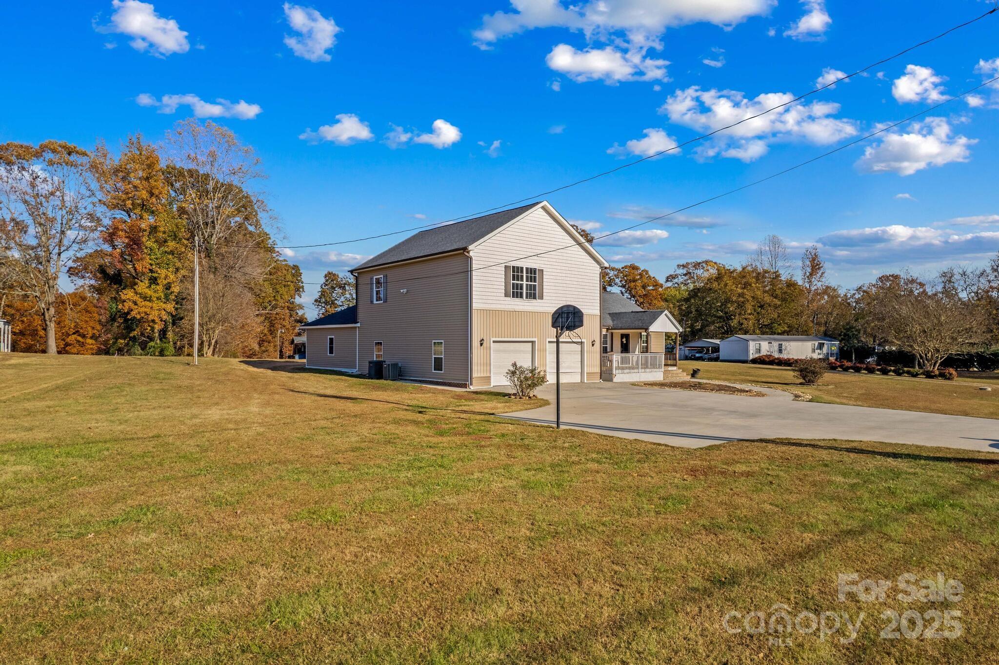 1493 Swicegood Road Linwood, NC 27299 - Photo 44 of 45 a view of the house with a yard