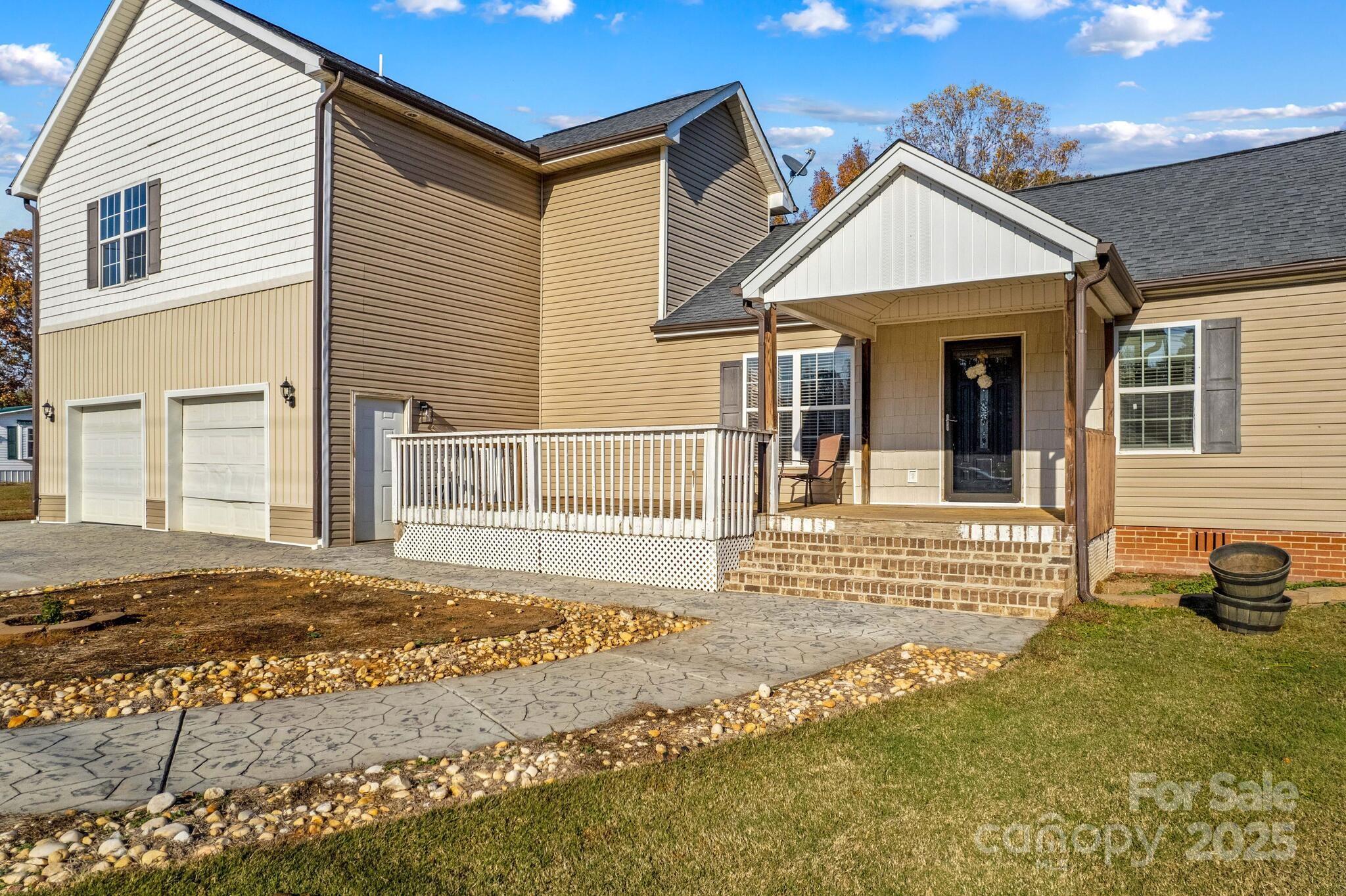 1493 Swicegood Road Linwood, NC 27299 - Photo 5 of 45 a front view of a house with a yard