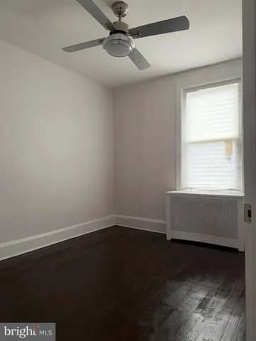 a view of an empty room and stairs