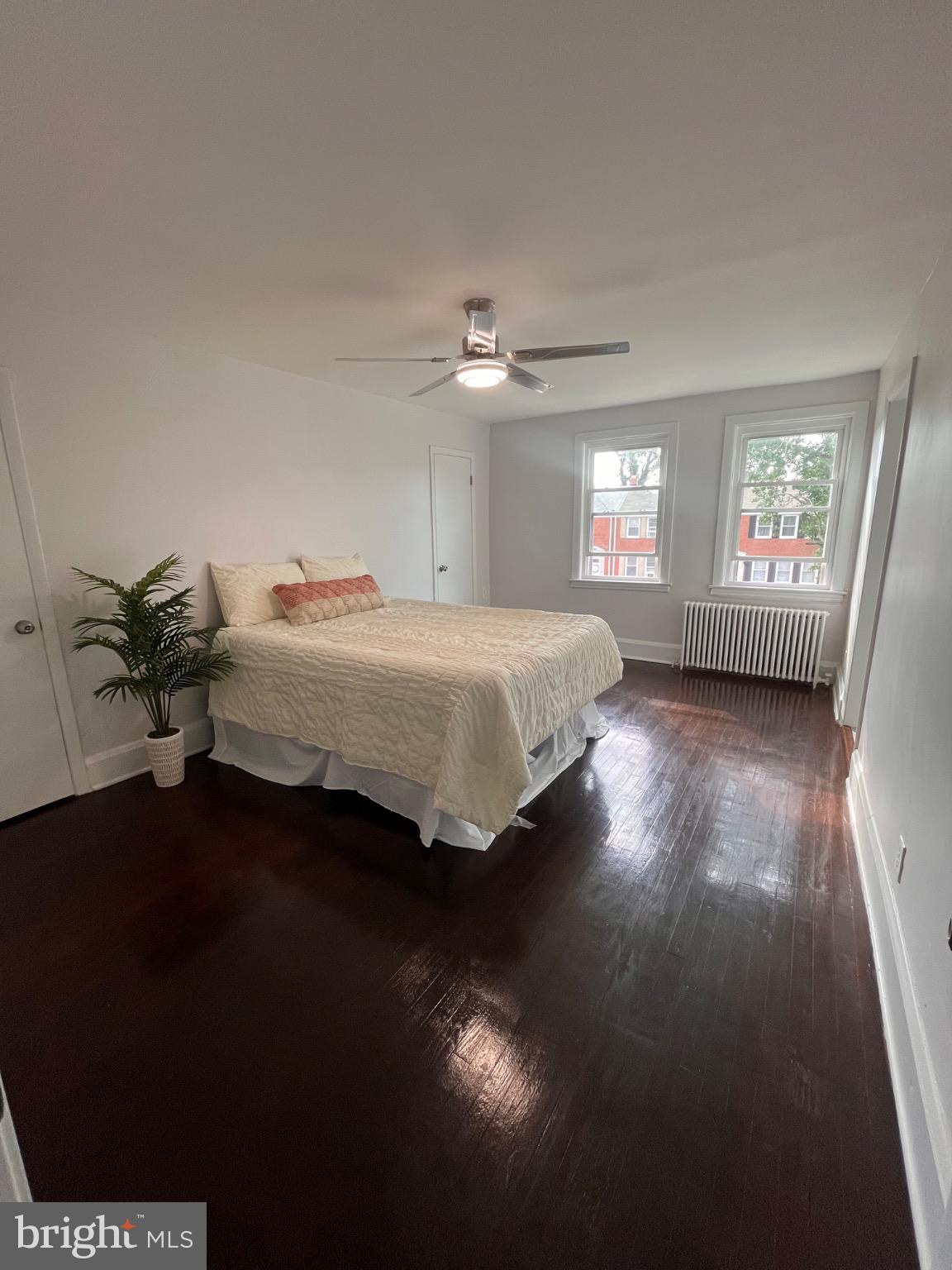 4027 Annellen Road Baltimore, MD 21215 - Photo 6 of 16 a bedroom with a bed and a chandelier