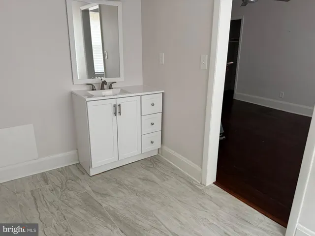 a bathroom with a toilet a sink and bathtub