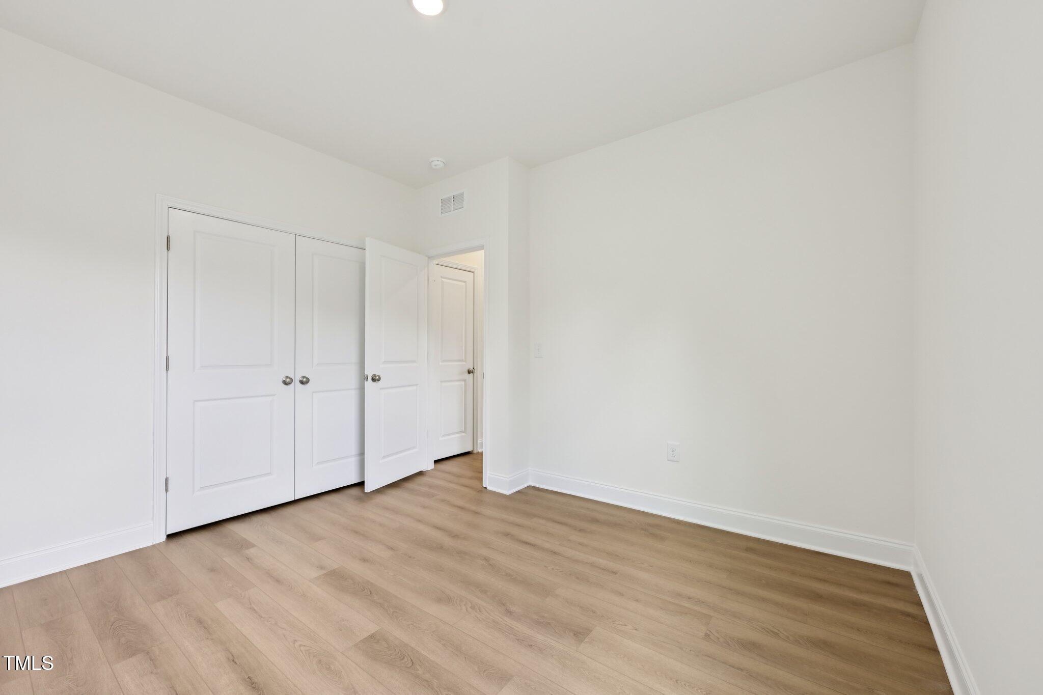 214 Alden Way Angier, NC 27501 - Photo 15 of 35 a view of an empty room