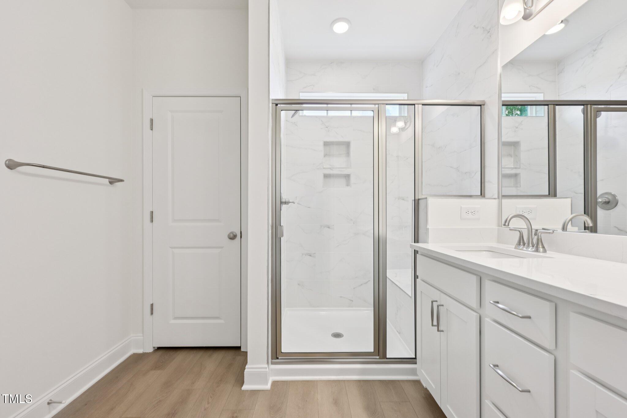 214 Alden Way Angier, NC 27501 - Photo 21 of 35 a bathroom with a double vanity sink and mirror
