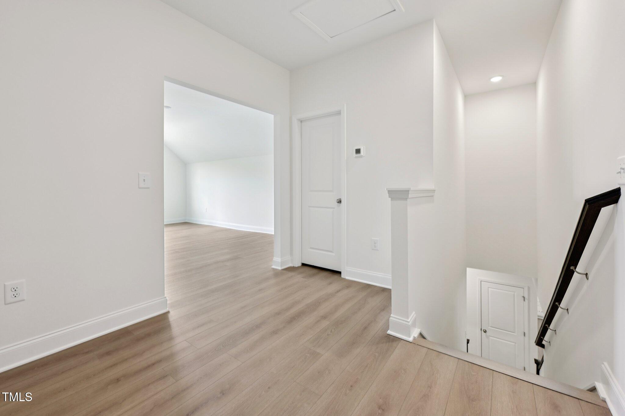 214 Alden Way Angier, NC 27501 - Photo 24 of 35 a view of a hallway with wooden floor