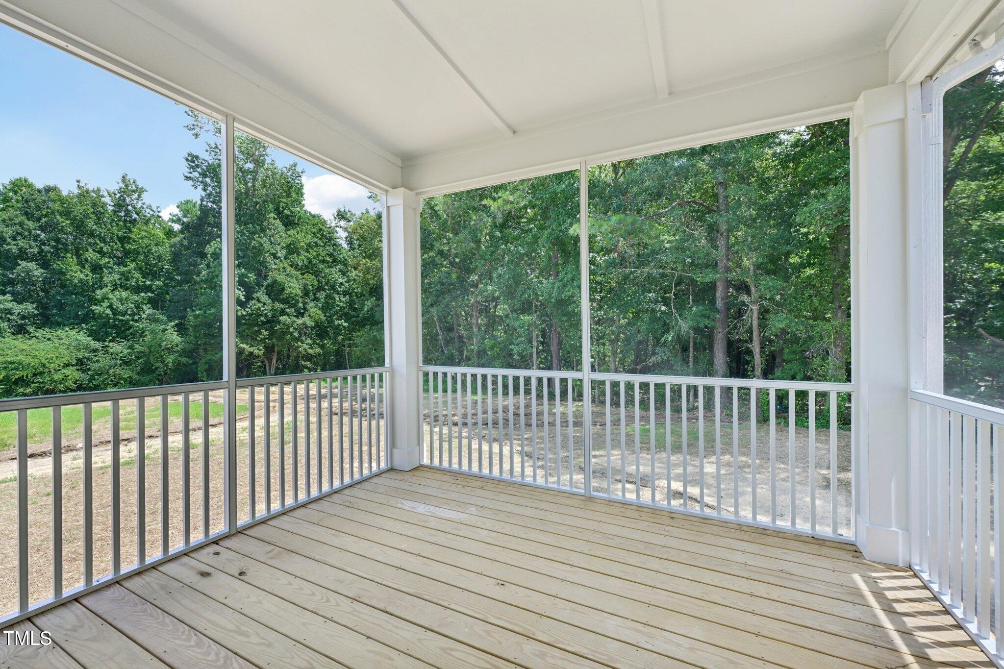 214 Alden Way Angier, NC 27501 - Photo 28 of 35 a view of balcony with wooden floor
