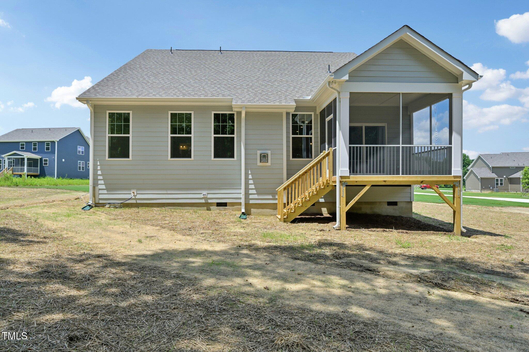214 Alden Way Angier, NC 27501 - Photo 32 of 35 a view of a house with backyard
