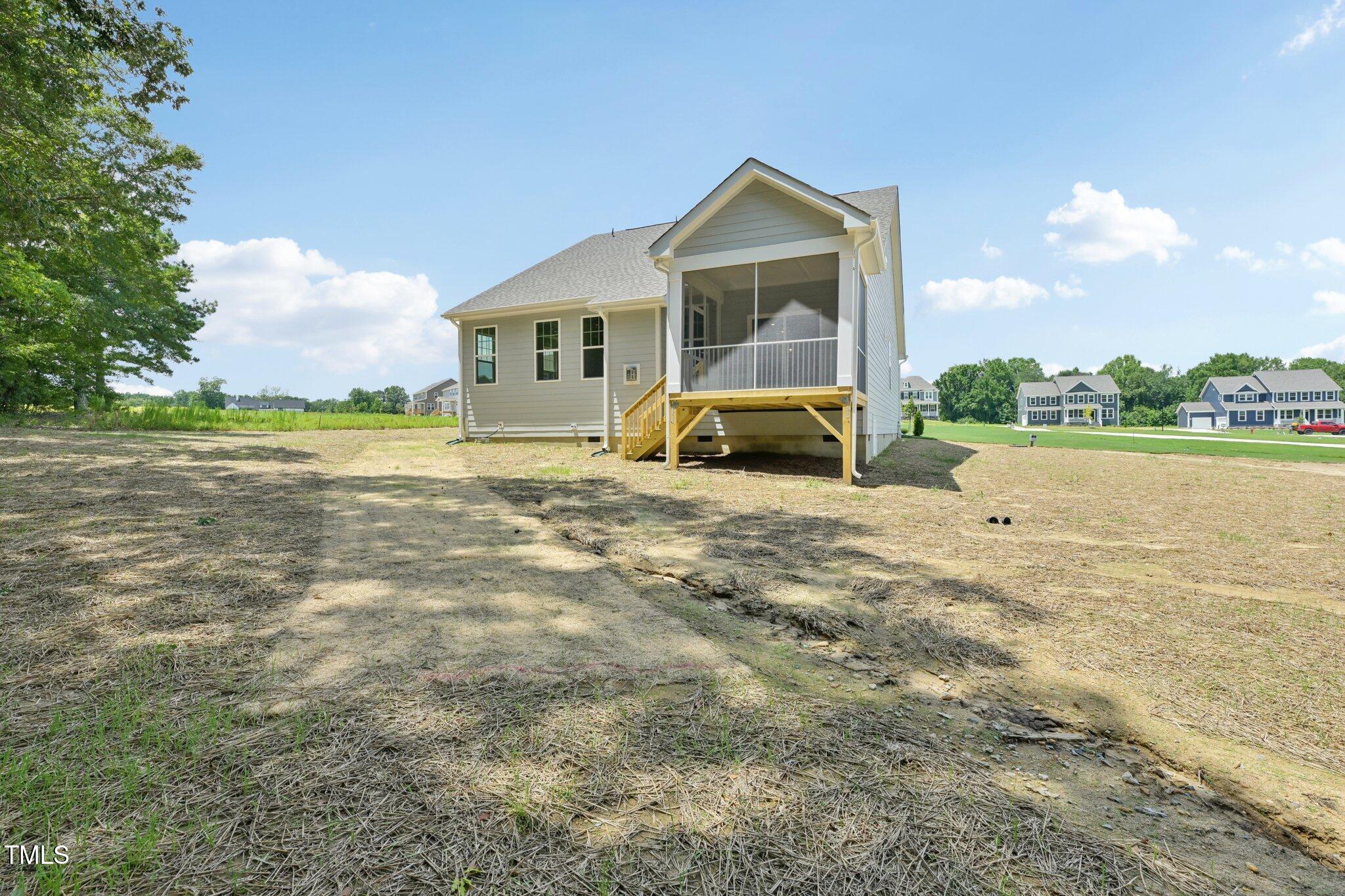 214 Alden Way Angier, NC 27501 - Photo 34 of 35 a view of a house with a yard
