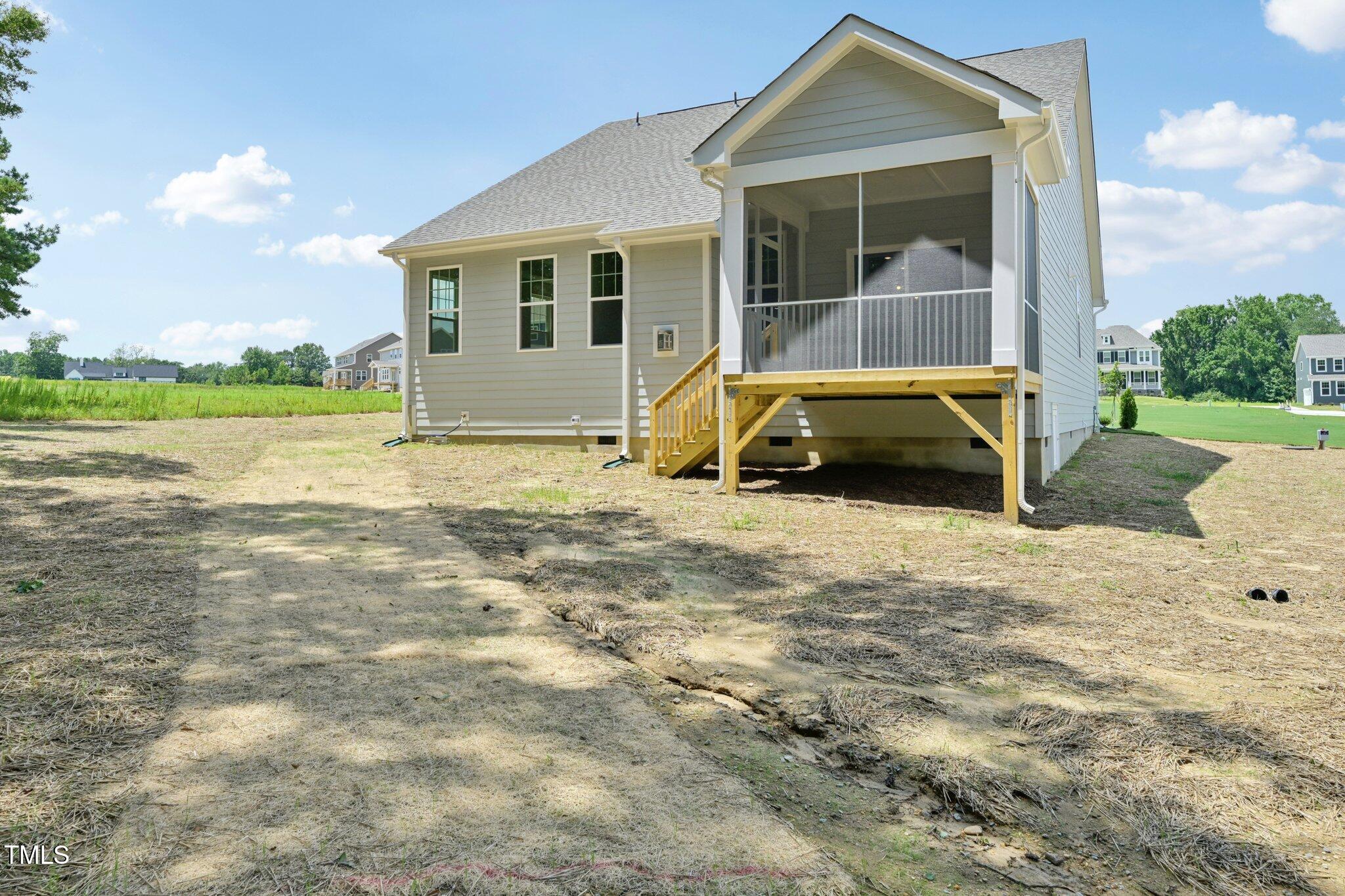 214 Alden Way Angier, NC 27501 - Photo 35 of 35 a view of a house with backyard and porch