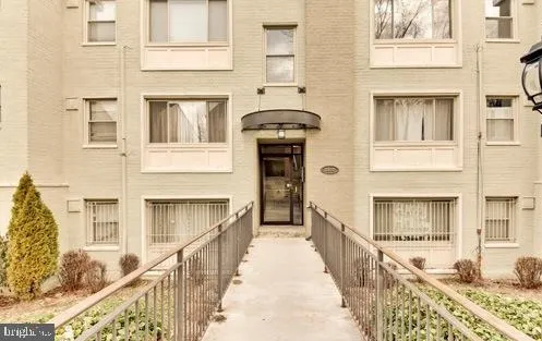 a front view of a house with many windows