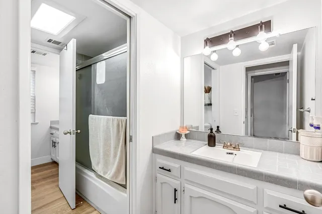 a bathroom with a sink and mirror