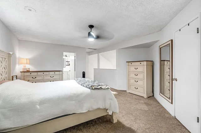 a bathroom with a toilet sink and shower