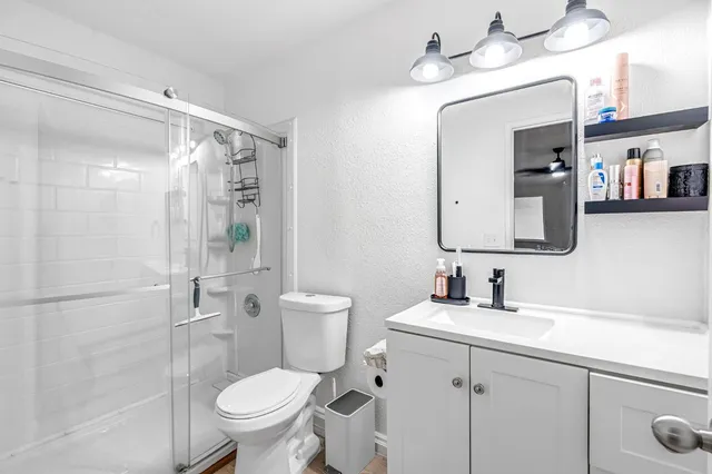 a view of a patio with couches and a fire pit