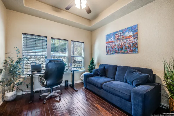a view of a livingroom with workspace and a couch