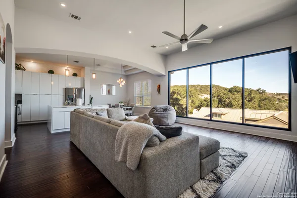 a living room with furniture and a large window