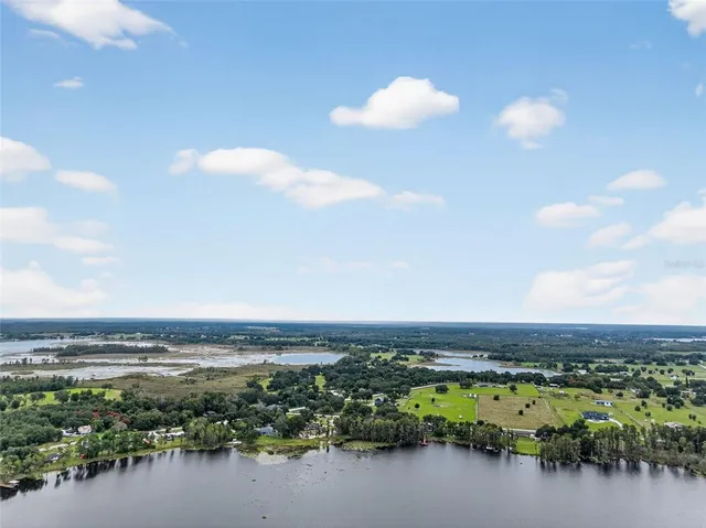 a living room with fireplace furniture and a flat screen tv