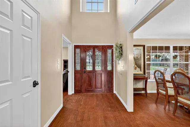 a large kitchen with granite countertop a sink a stove and cabinets