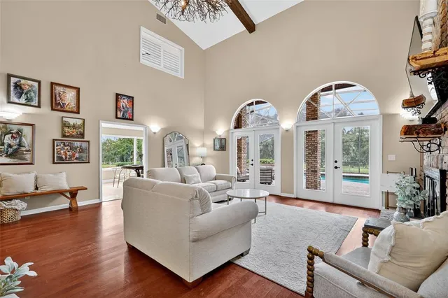 a kitchen with kitchen island granite countertop a sink a counter top space and stainless steel appliances