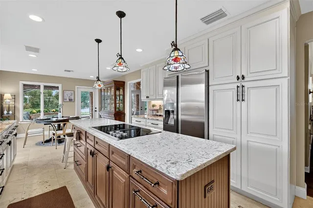 a spacious bathroom with double vanity and a mirror