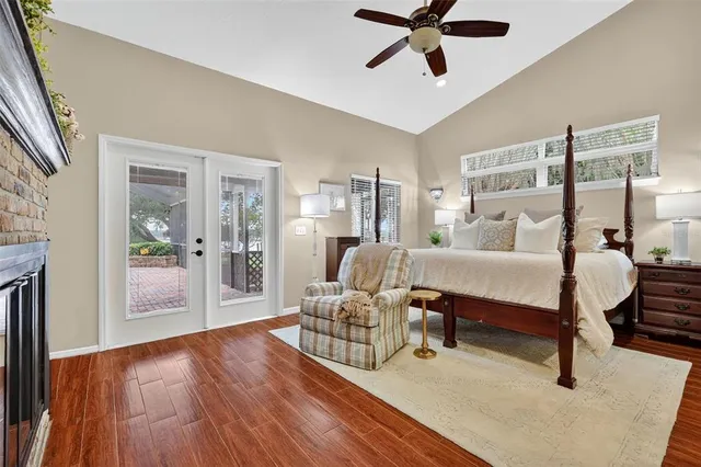 a bedroom with furniture and a flat screen tv