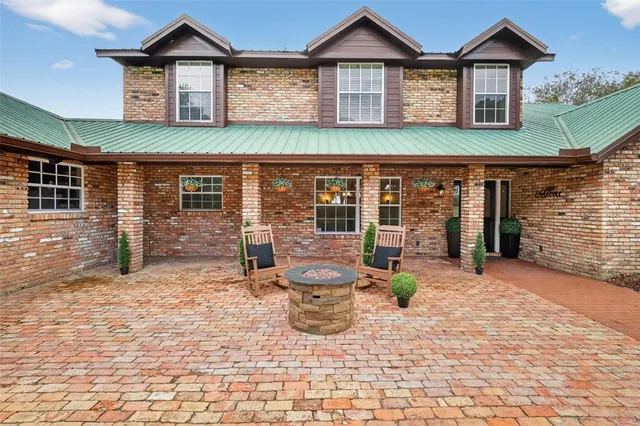 a view of a park with large trees